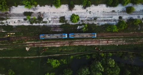 Two Wagon Modern Train Stopping In Remote Swamp Tundra Area Aerial Top Down Stock Footage 300441954