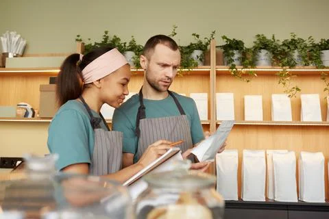 Two Waiters Doing Inventory at Bar Stock Photos