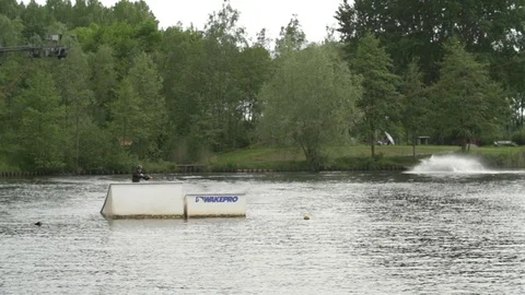 Two wakeboarders performing tricks [Slomo] Stock Footage 70133504