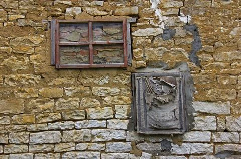 Two walled old windows in a stone wall Stock Photos