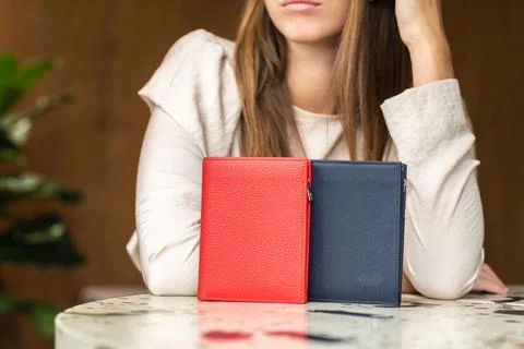 Two wallets on table, red and blue Stock Photos