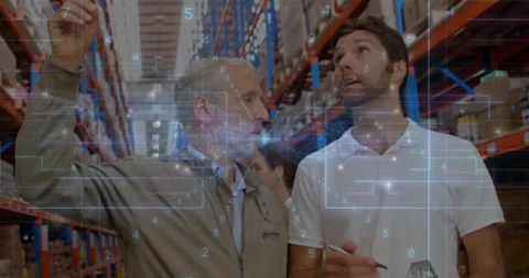 Two warehouse staff inspecting inventory in aisle, highlighting data overlay and Stock Footage 308656533