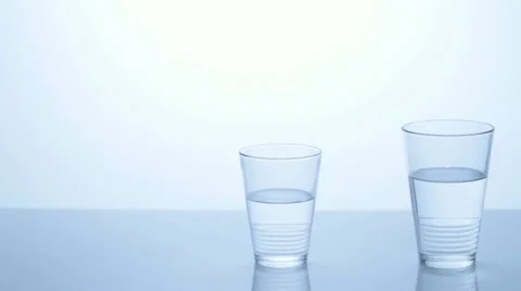 Two water glasses with different levels. Video stock 11606346