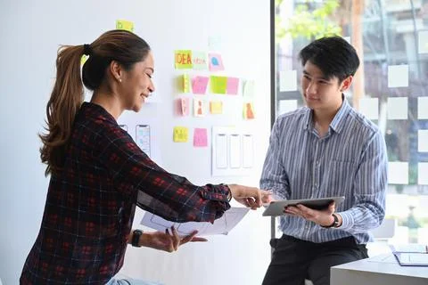 Two web developer are planning sketch, prototype, framework, layout app design Stock Photos