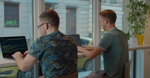 Two Web developers working at the computer inthe modern office. Stock Photos