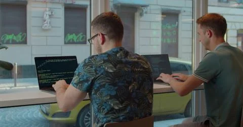 Two Web developers working at the computer inthe modern office. Stock Photos