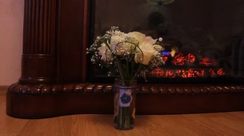 Two wedding bouquet against the background fireplace (dolly) Video stock 40469831