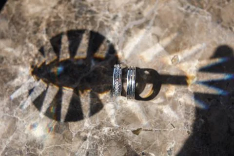 Two wedding ring on a stone background Stock Photos
