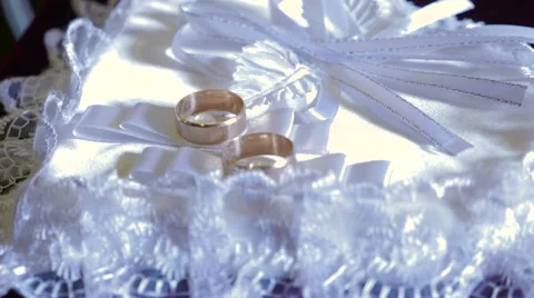 Two wedding ring on white heart Stock Footage 68081302
