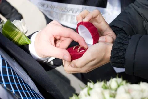 Two wedding rings in the box which takes a man Stock Photos