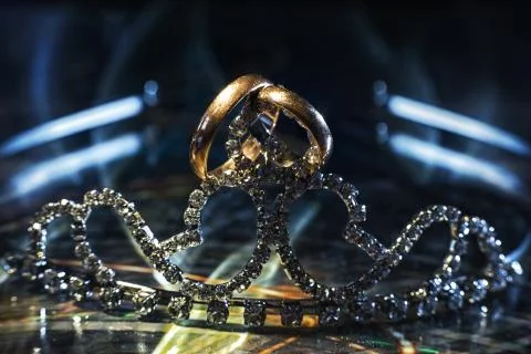 Two wedding rings of different sizes made in gold on tiara Stock Photos