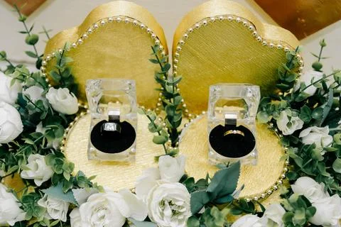 Two wedding rings displayed in clear boxes Stock Photos