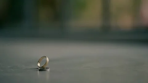 Two wedding rings on the empty table. wedding day Stock Footage 221923848