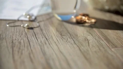 Two wedding rings, an engagement ring, jewelry on the neck and ears, earrings, a Stock Footage 171456166