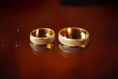 Two wedding rings on red background. Wedding rings Stock Photos