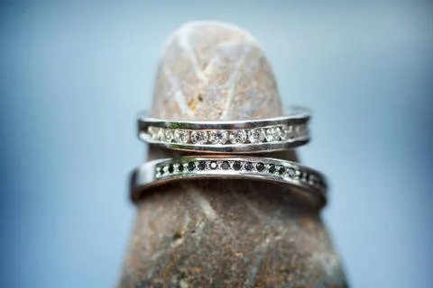 Two wedding rings on a rock Stock Photos