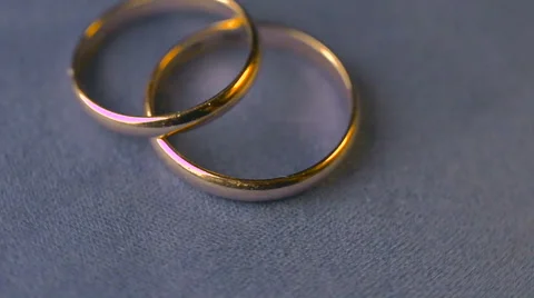 Two wedding rings rotation Stock Footage 57313886