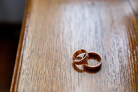 Two wedding rings on the table Stock Photos