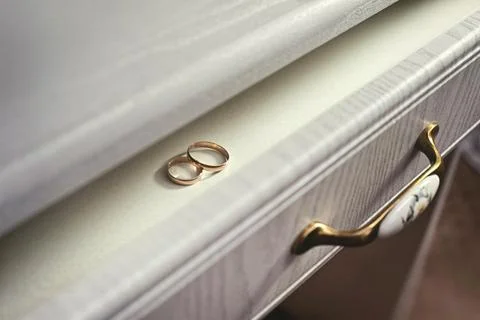 Two wedding rings on white table. Wedding Stock Photos