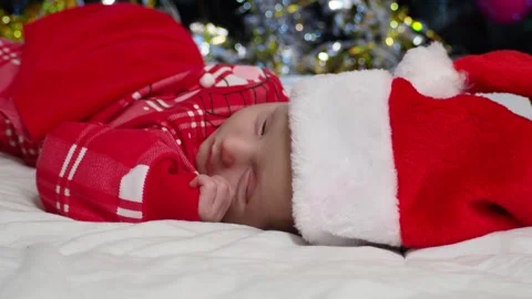 Two week old, newborn, baby boy with a Santa a New Year&amp;#039;s Christmas Stock Footage 293729161