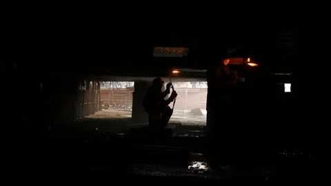 Two welders in dry dock under the ship Stock Footage 87453777