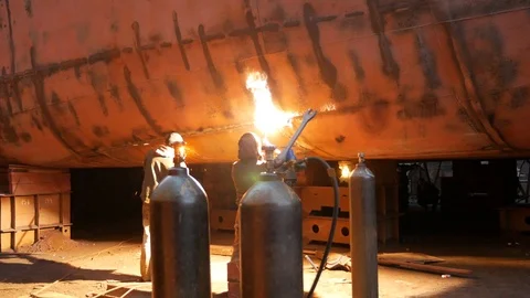 Two welders work in dry dock Stock Footage 87084866