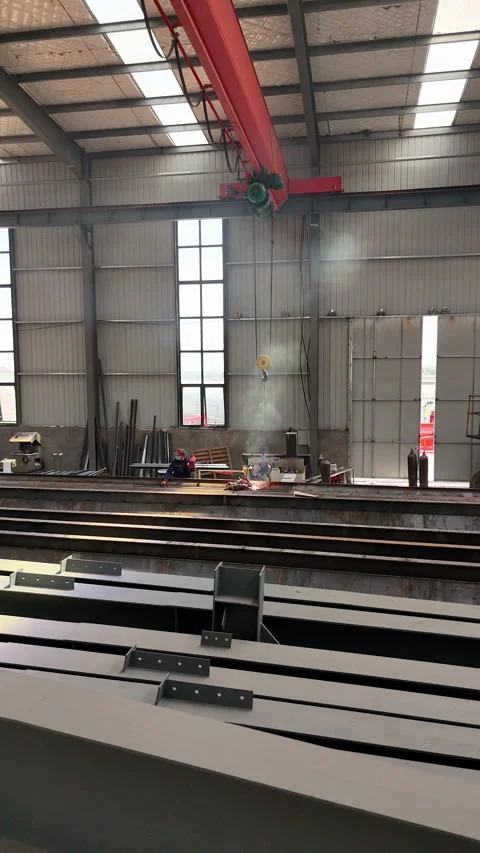 Two Welders Working on Metal Beam in Industrial Factory, 4K Stock Footage 335793410