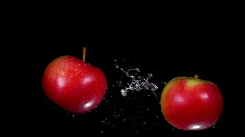 Two wet red apples collide with each other Stock-Footage 122646619