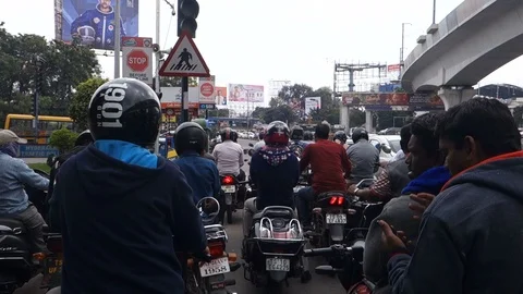 Two-wheeler-motorcyclists-waiting-at-traffic-signal-India Stock Footage 101408984