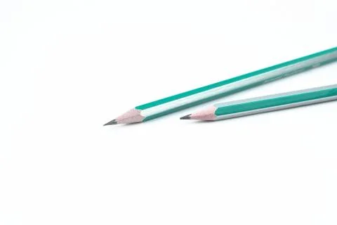 Two white and blue colored wood pencil crayon placed on an isolated white bac Stock Photos