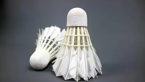 Two white badminton shuttlecocks on gray background Stock Photos
