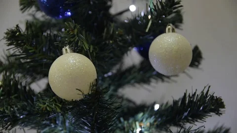 Two white balls on a Christmas tree with final blur (D5C 2605) Stock Footage 83398845