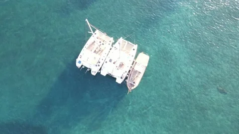 Two white catamarans and a boat Stock Footage 158809926