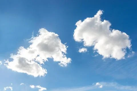 Two white clouds on the blue sky background Foto stock
