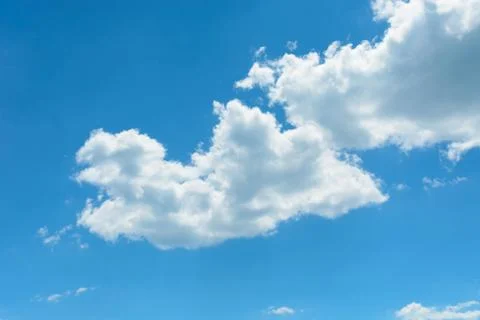 Two white clouds on the blue sky background 库存照片