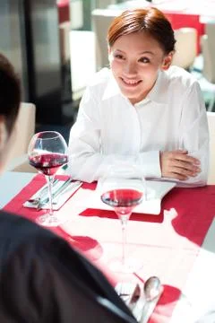Two white-collar workers are dining in a restaurant Stock Photos