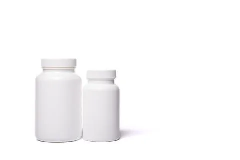 Two white containers for tablets Stock Photos