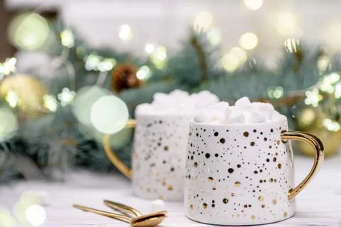 Two White cup of cocoa with marshmelow on the buckground of gold bokeh, New Y Stock Photos