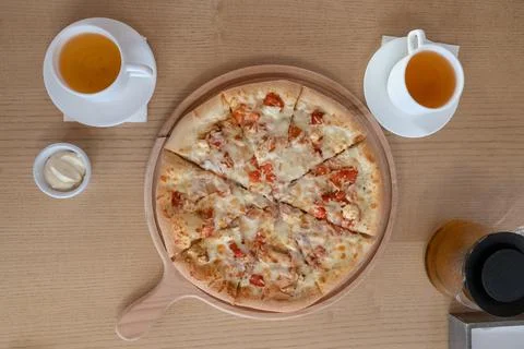 Two white cups with tea pizza sauce in a cafe on the table top view lunch food Stock Photos