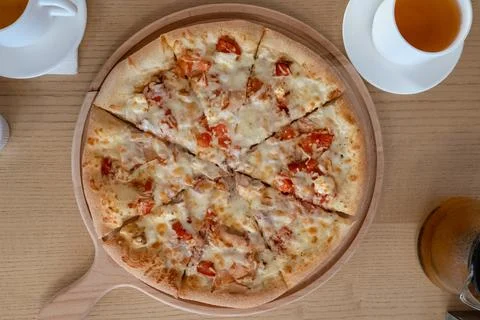 Two white cups with tea pizza sauce in a cafe on the table top view lunch food Stock Photos