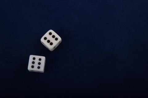 Two white dice cubes on blue background. Stock Photos