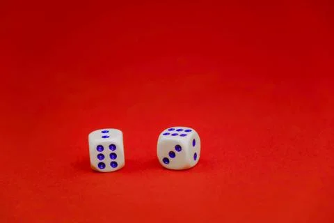 Two white dice on a red background Stock Photos