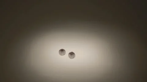 Two White Dices in Table Stock Footage 58506912