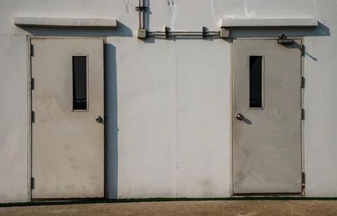 Two white doors of Machine control room. Fotos de archivo
