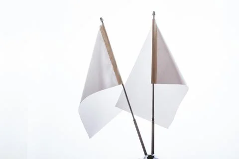 Two white flags on a white background in display Stock Photos