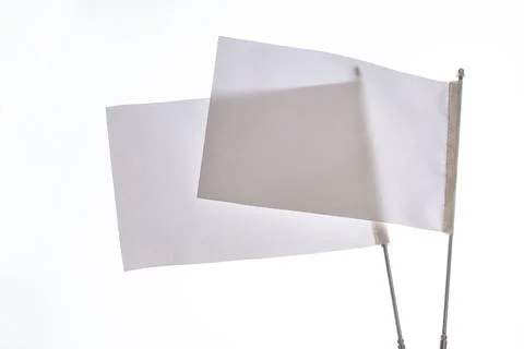 Two white flags on a white background in display Stock Photos