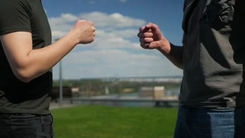 Two white guys greeting each other with cool modern handshake Vidéo 197637755