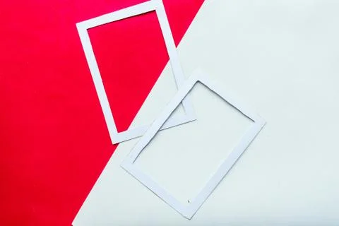 Two white mockup photo frames on geometric red and white background. Copy spa Foto stock