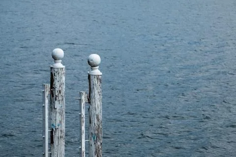 Two white mopring poles Stock Photos