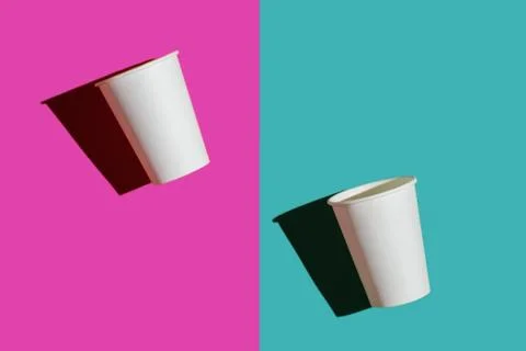 Two white paper biodegradable cups on colored backgrounds Stock Photos